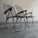 Set of two vintage folding chairs with an aluminium wire frame.