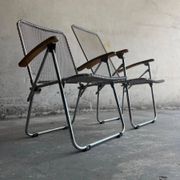 Set of two vintage folding chairs with an aluminium wire frame.
