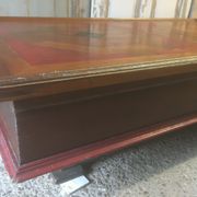 Coffee table with storage for bottles and glasses in oak.