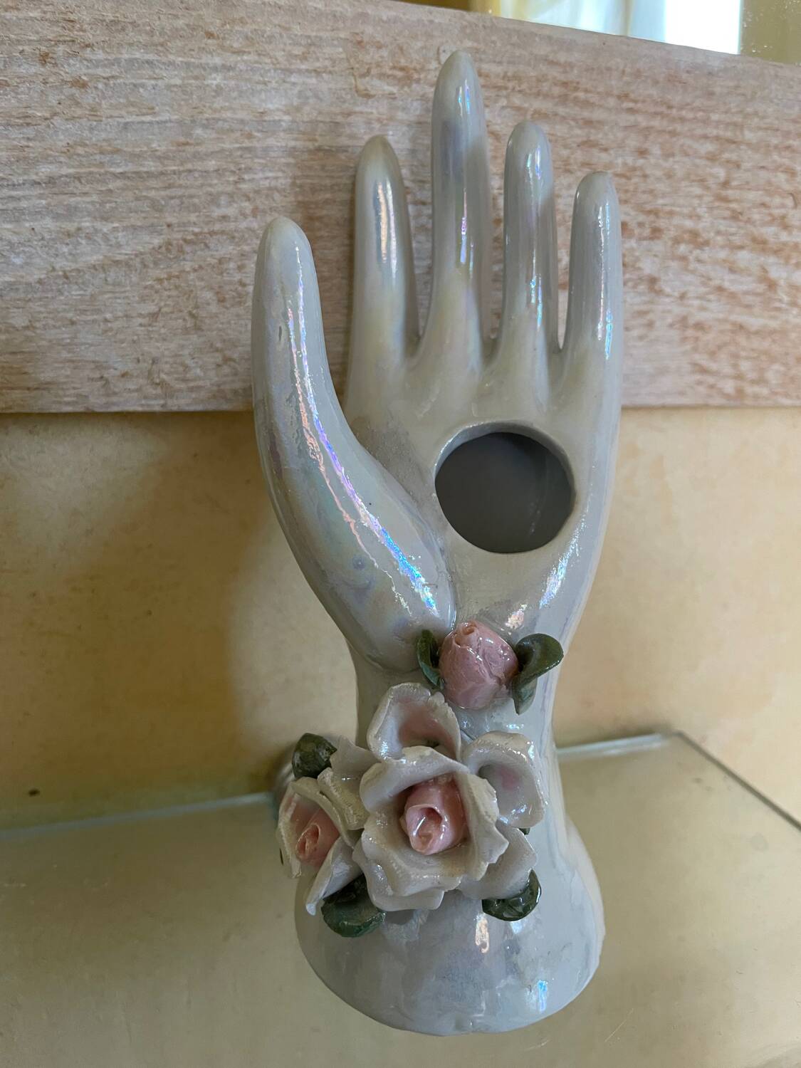 Hand holds jewelry or soliflore