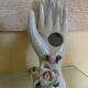 Hand holds jewelry or soliflore