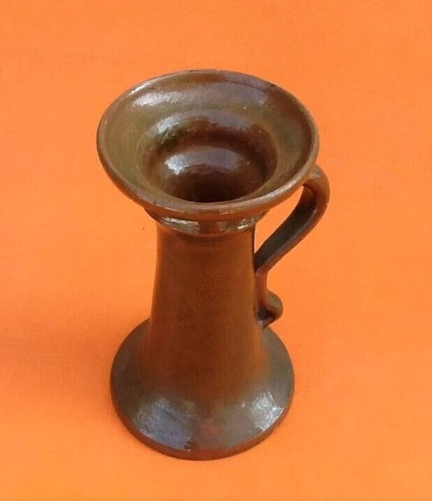 Varnished terracotta spool candlestick