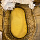 1960s wicker cradle with mattress and drapes.
