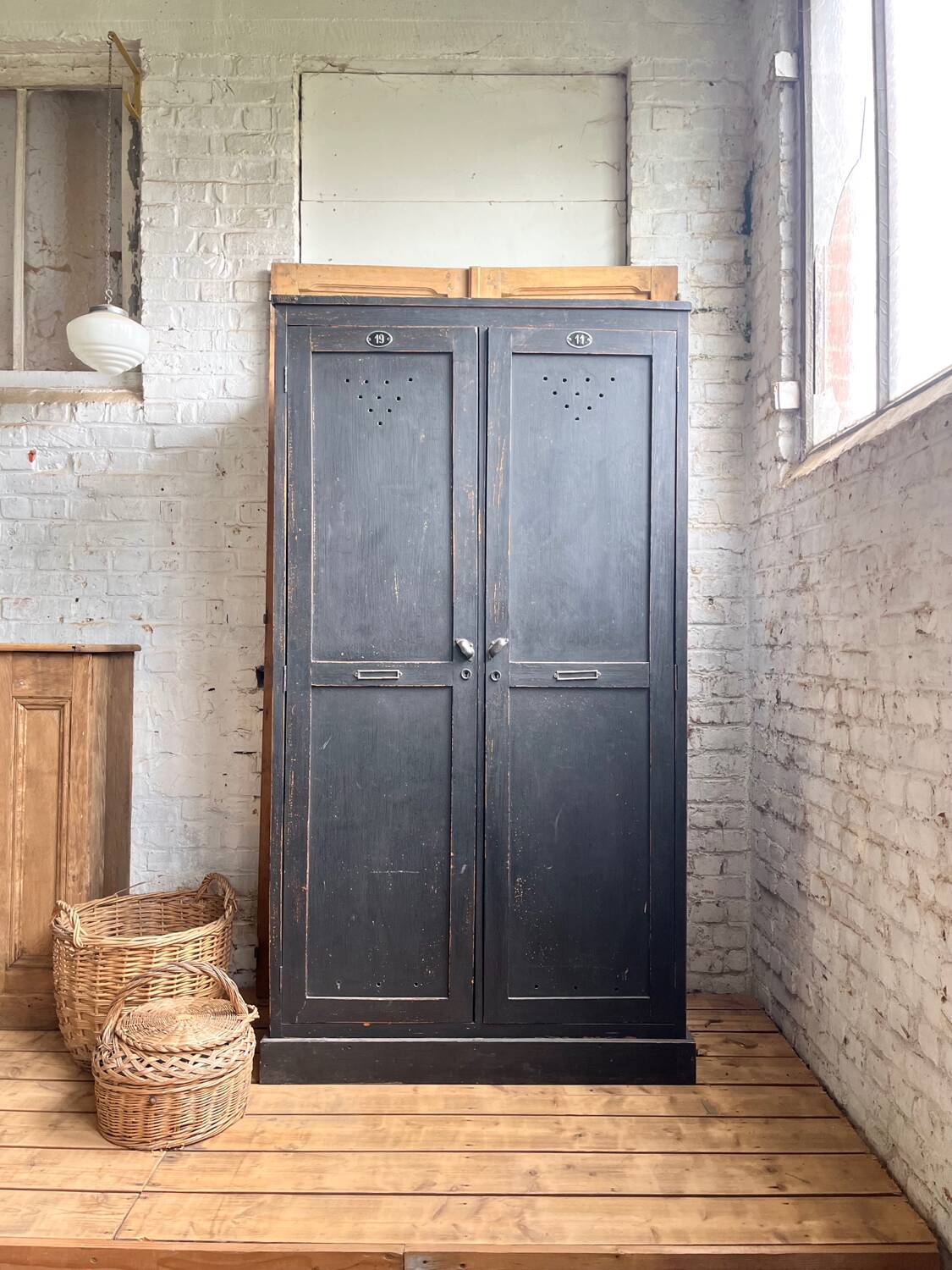 Old wooden locker with black patina