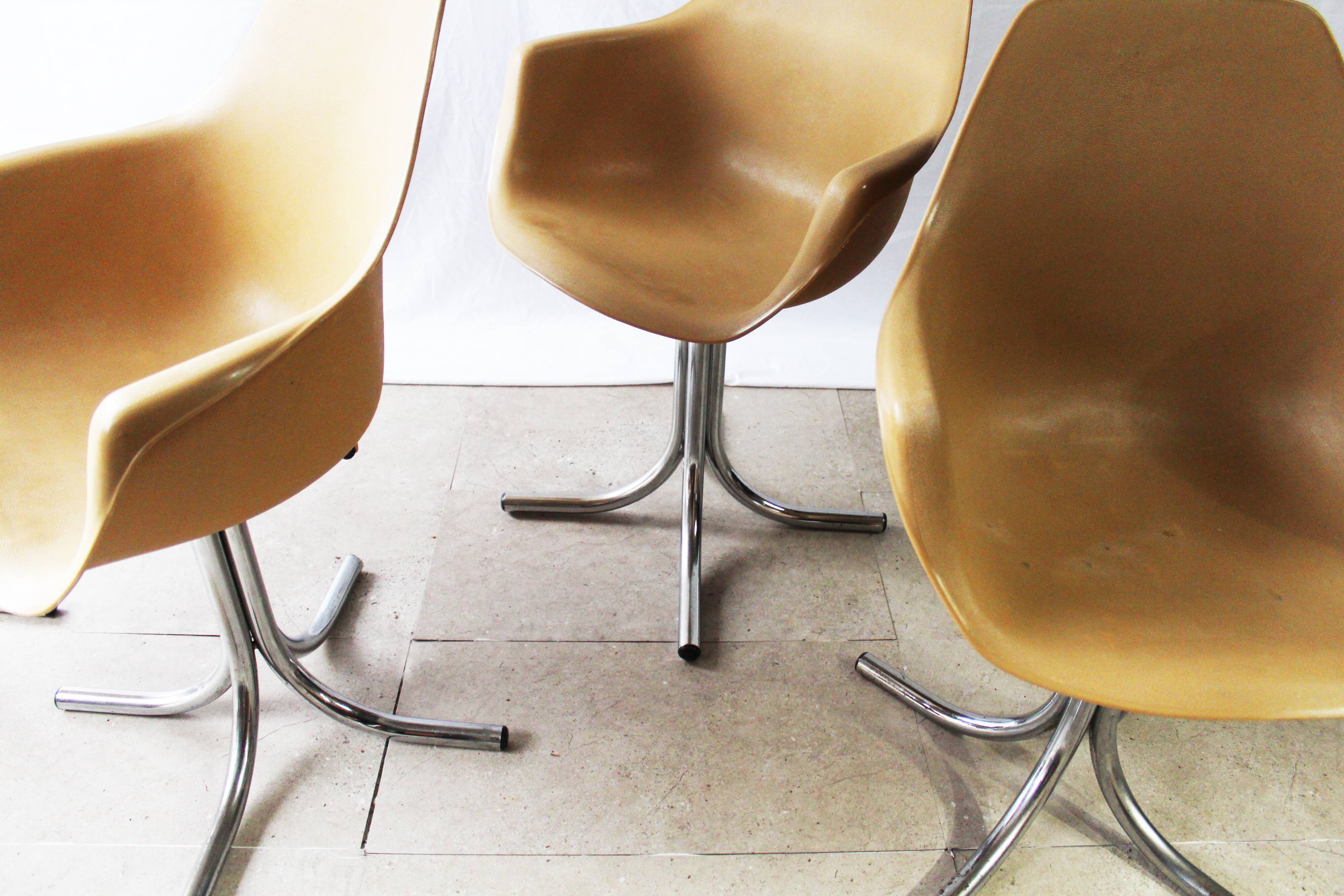 Set of 4 plastic dining armchairs 1960s