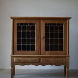 20th-century mid-century solid oak sideboard with glass front, by a Danish cabinetmaker.