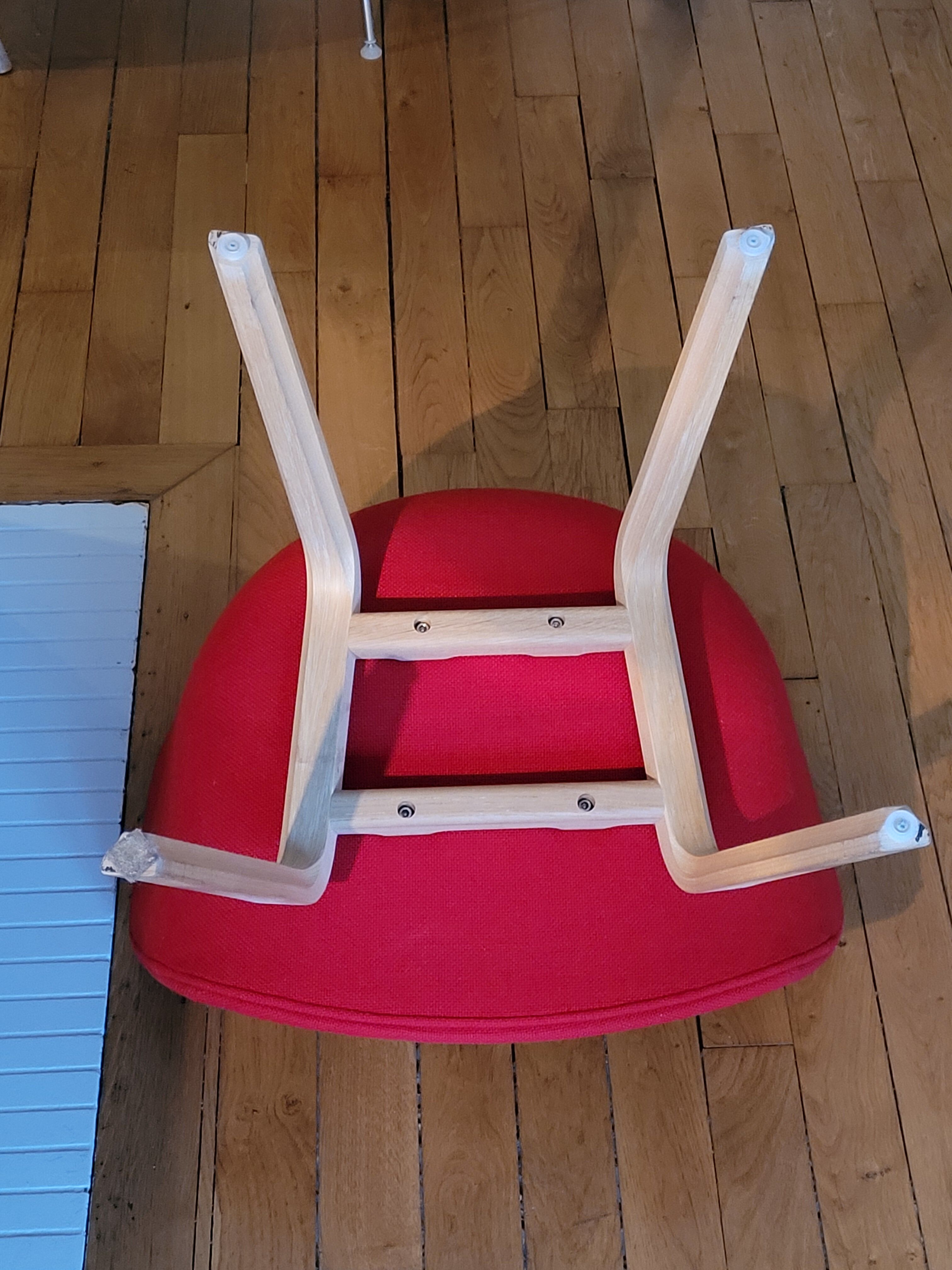 red canvas and wood armchair