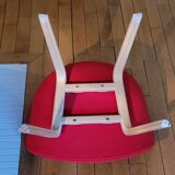 red canvas and wood armchair