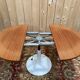 Round dining table with tulip base, 1960s design.