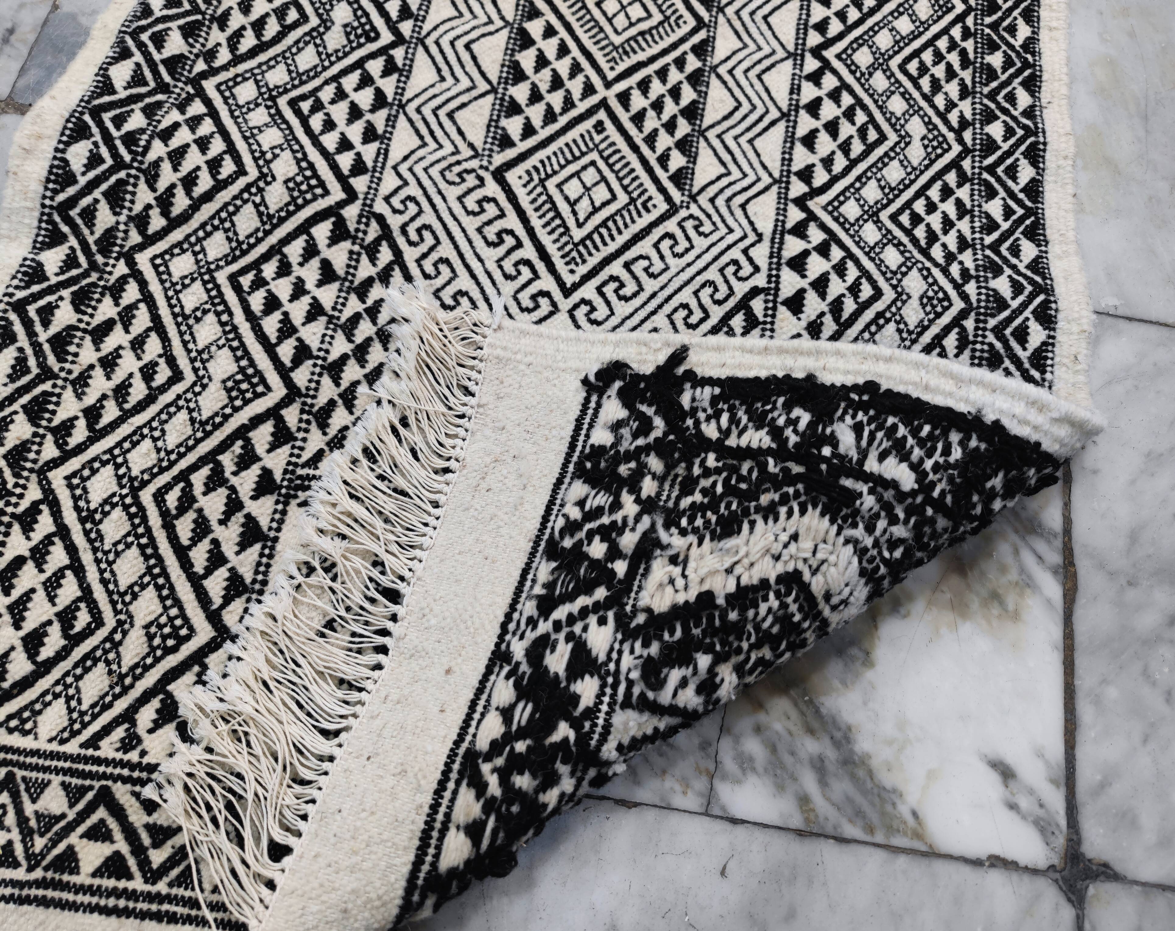 Handwoven black and white rug