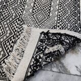 Handwoven black and white rug