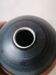 Vase boule en céramique signé