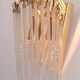 Pair of gold metal wall lights with tassels