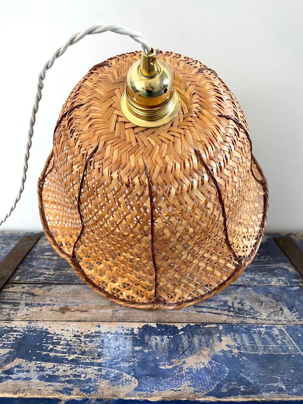 Vintage suspension in electrified braided wicker to nine