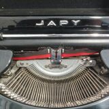 Machine à écrire japy portable ancienne avec son coffre comme neuve