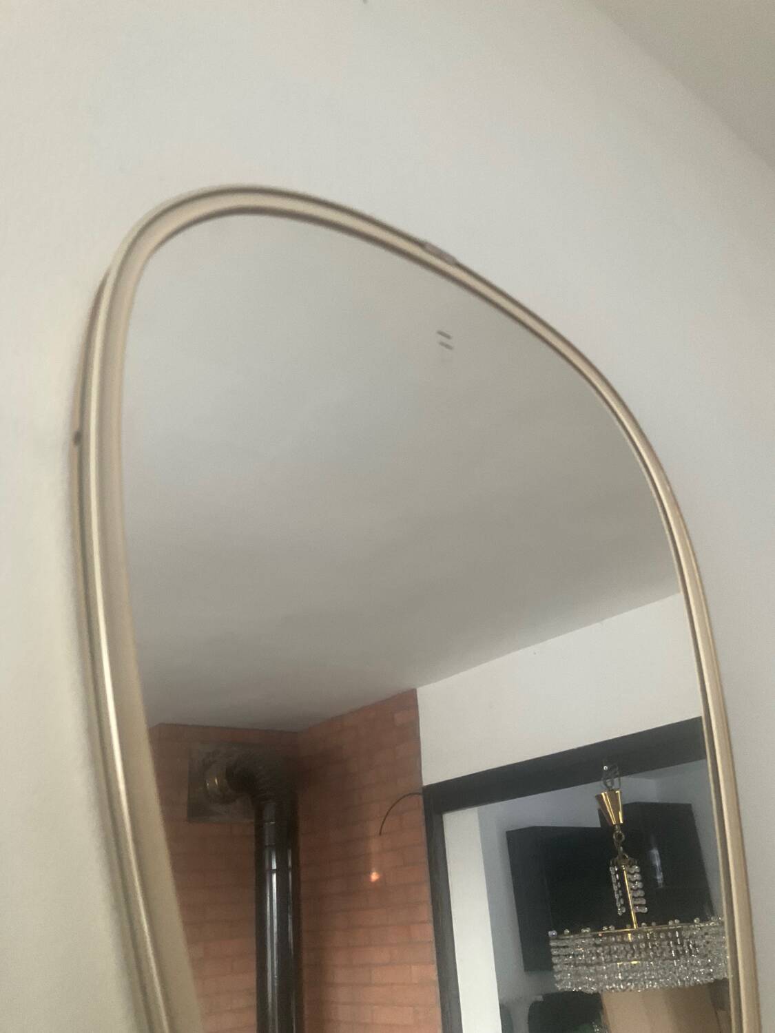 Asymmetrical free-form mirror from the 60s-70s