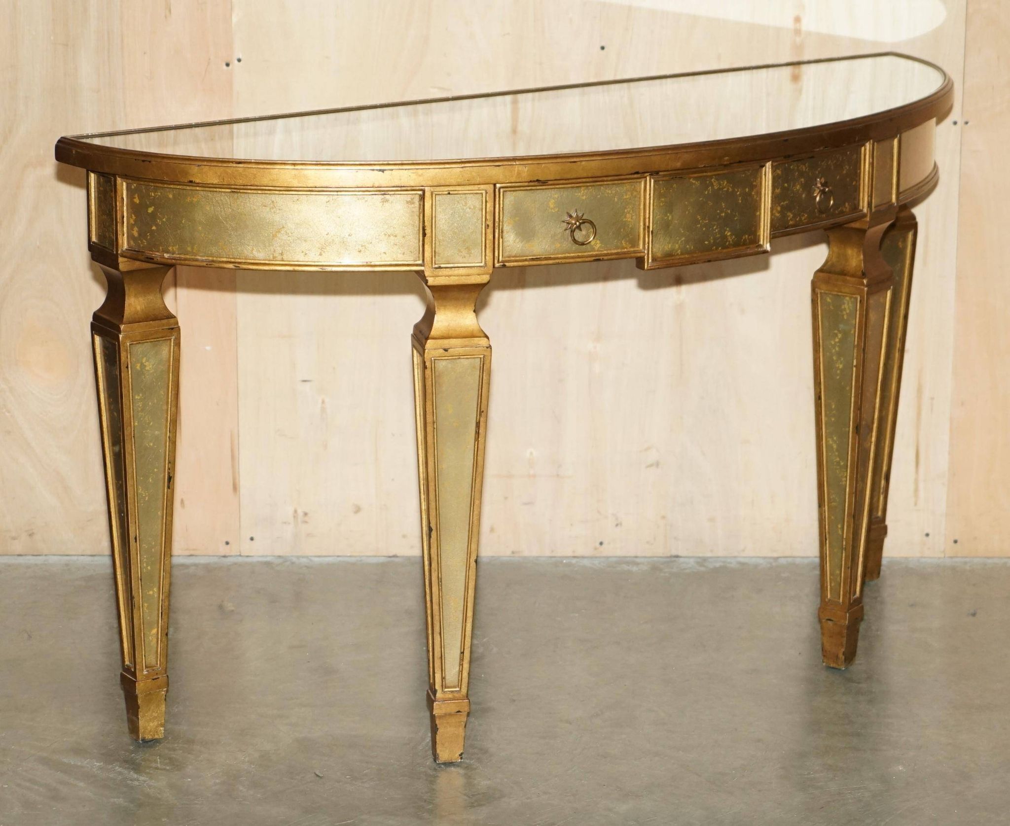 Half-moon console Eglomise Theodore Alexander with a gold finish.
