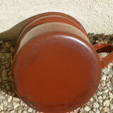 Old enameled steel pitcher