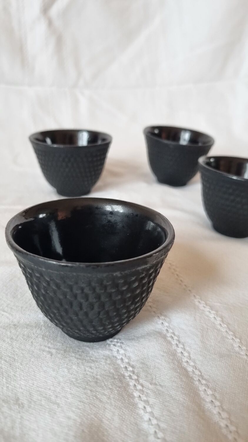 4 black cast iron teacups