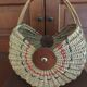 Large antique half-moon rattan basket