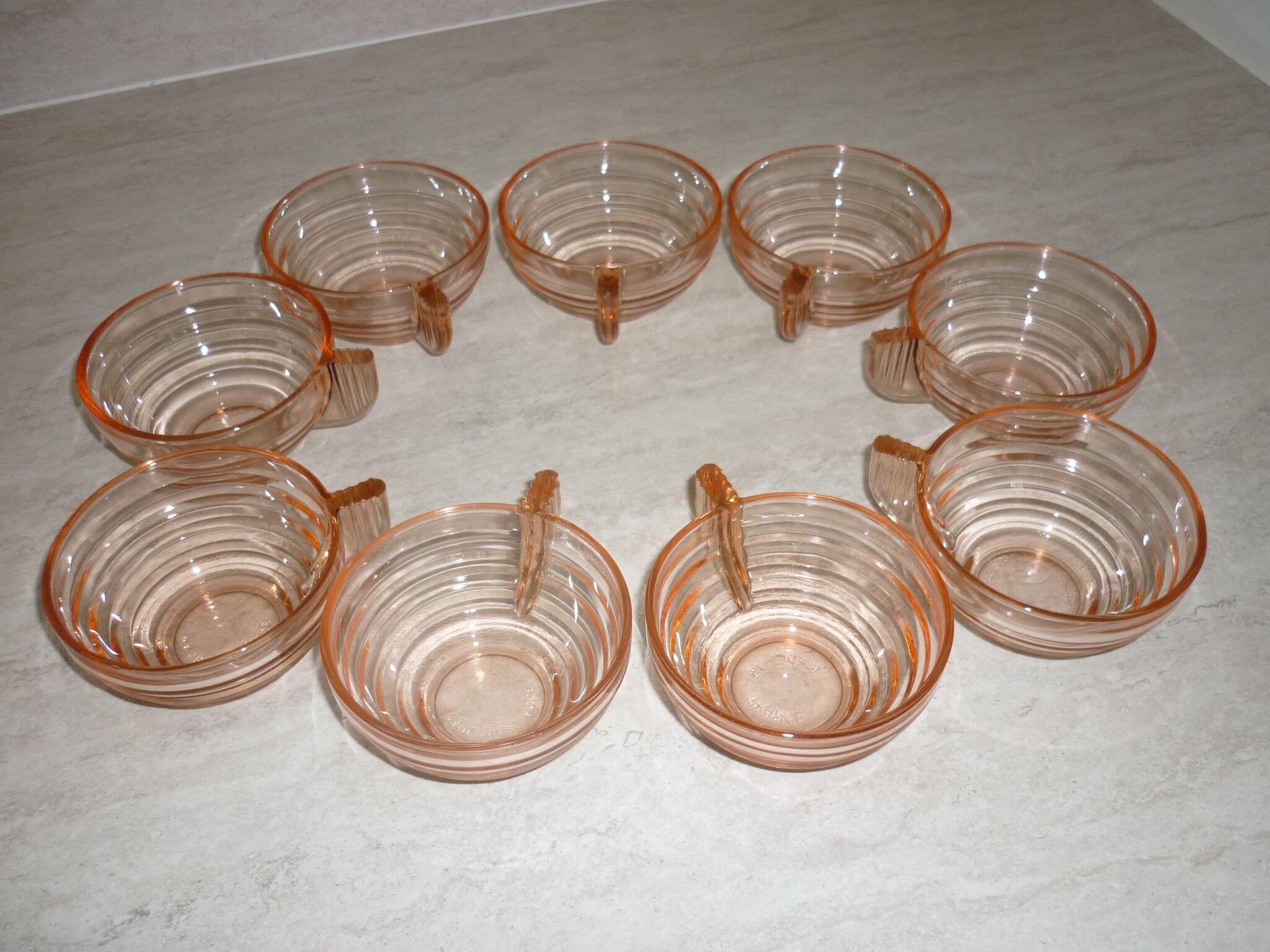 Lot 9 art deco cups in pink transparent glass