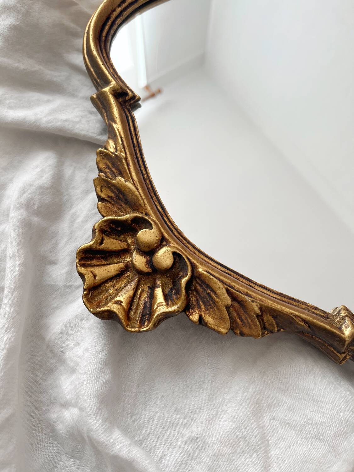 Antique Louis XV gilded mirror with vintage rocaille shell