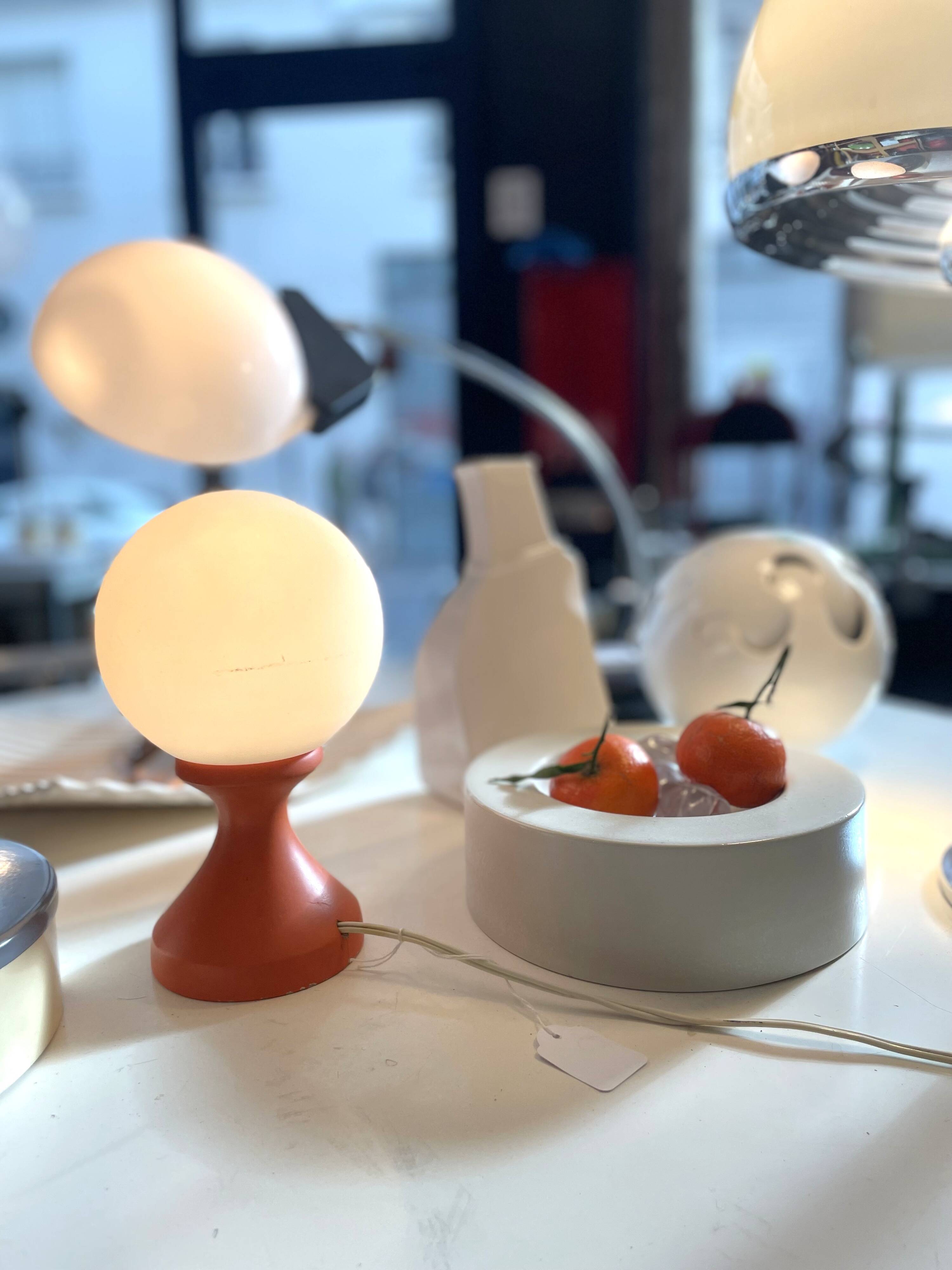 Small 1970s orange tulip-shaped ball lamp on a stand