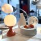 Small 1970s orange tulip-shaped ball lamp on a stand