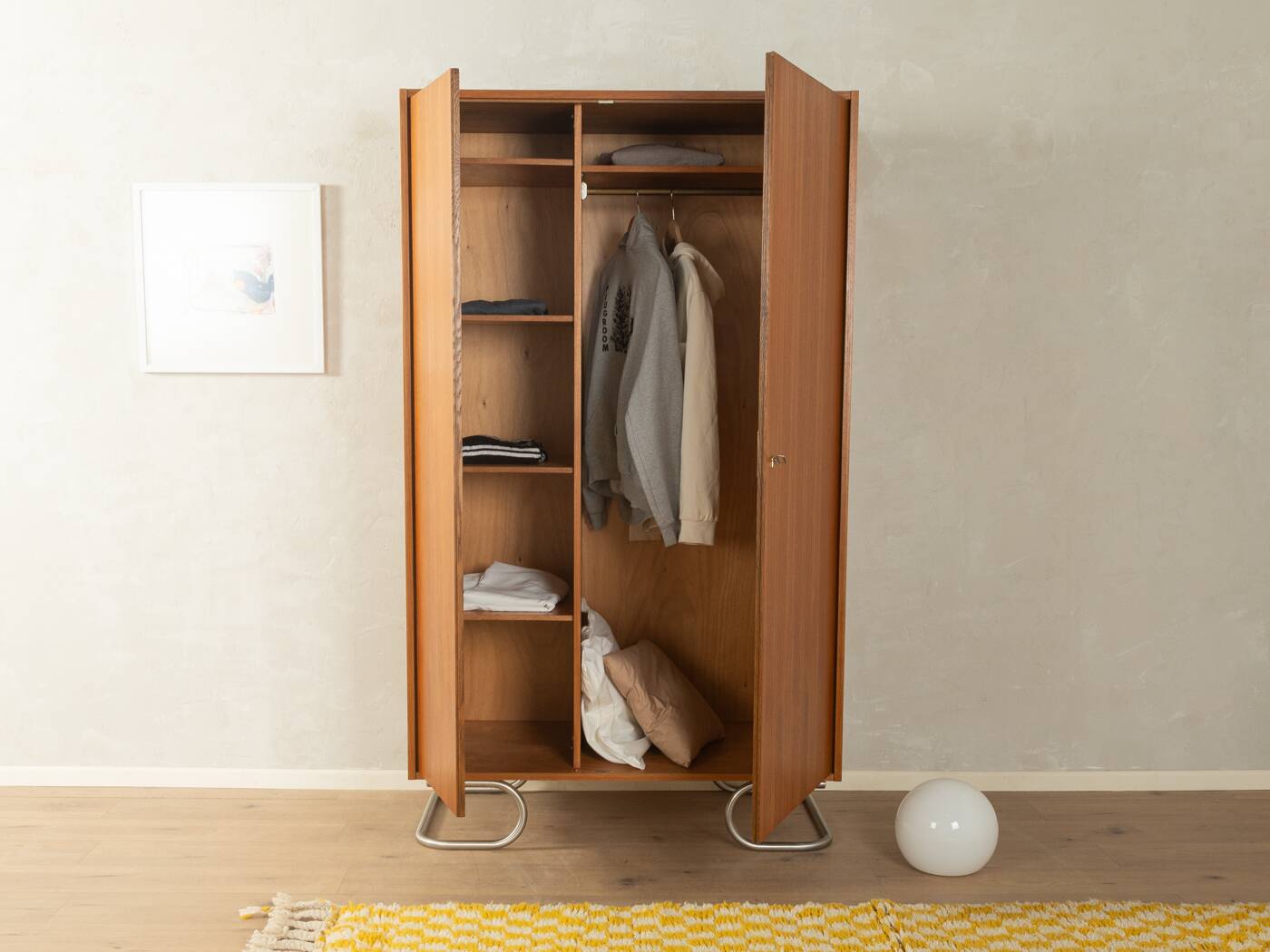 Purist wardrobe from the 1960s in teak veneer by DeWe