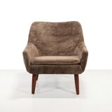 Danish design armchair in brown faux sheepskin