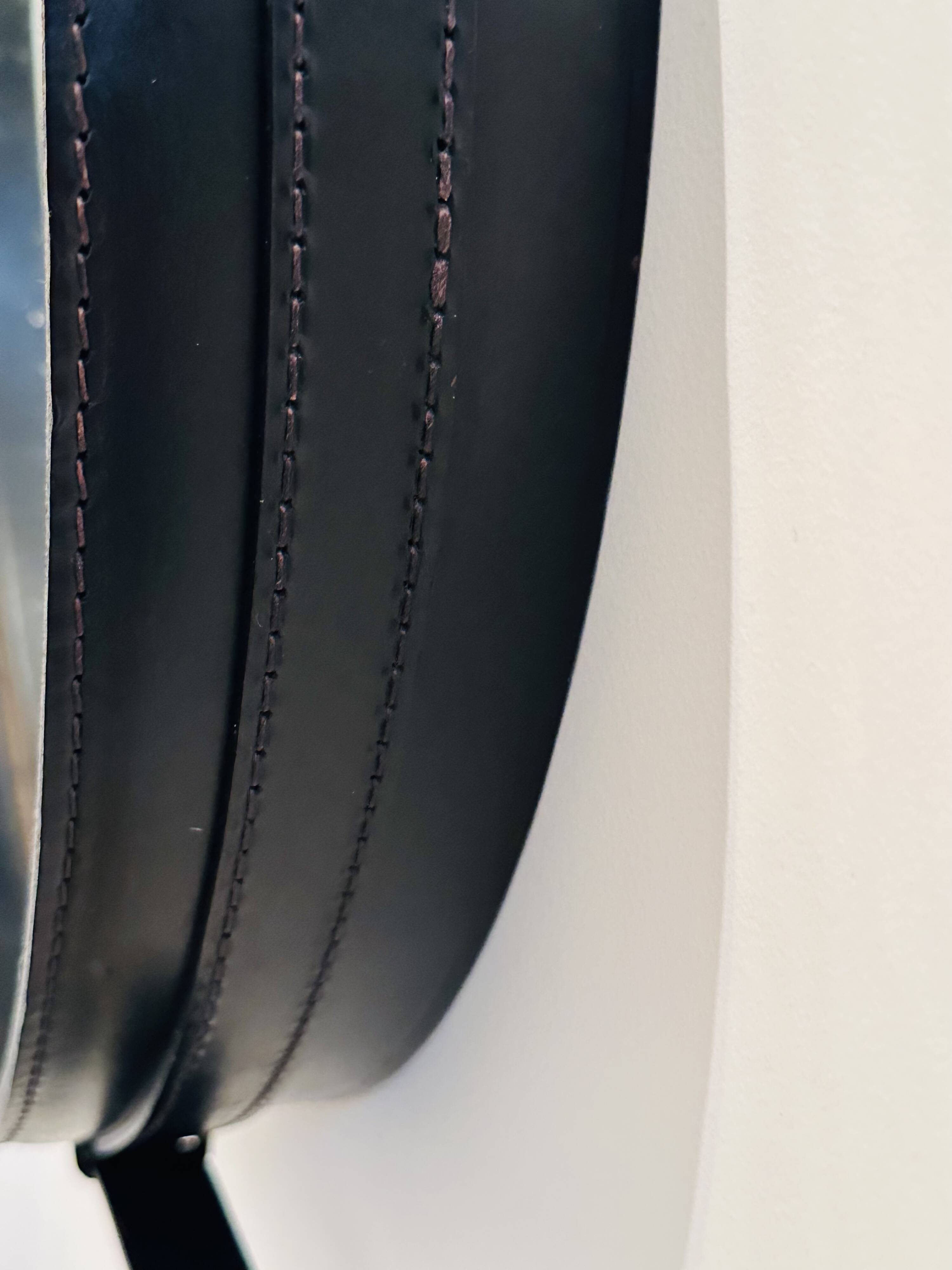 Jacques Adnet circular leather and brass mirror