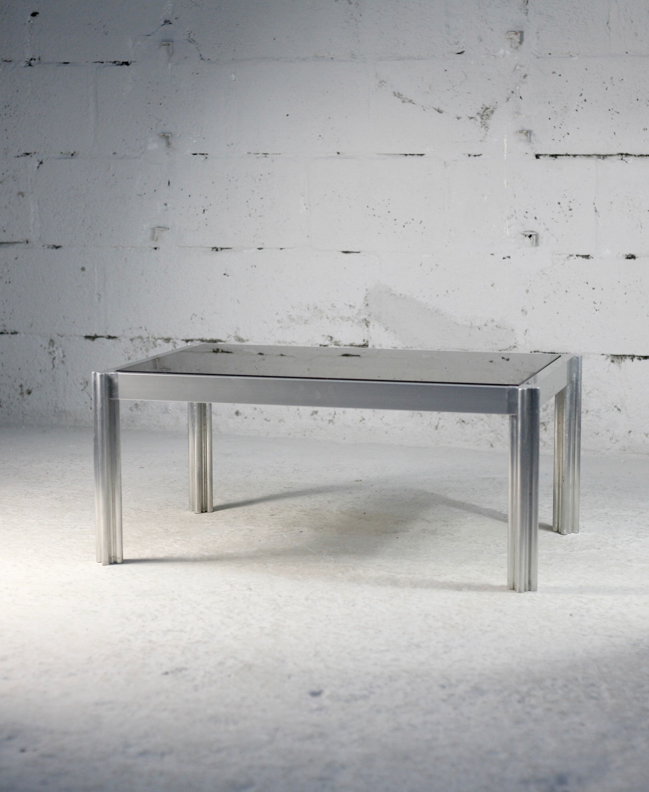 International Furniture. Steel coffee table and smoked glass. Circa 1970