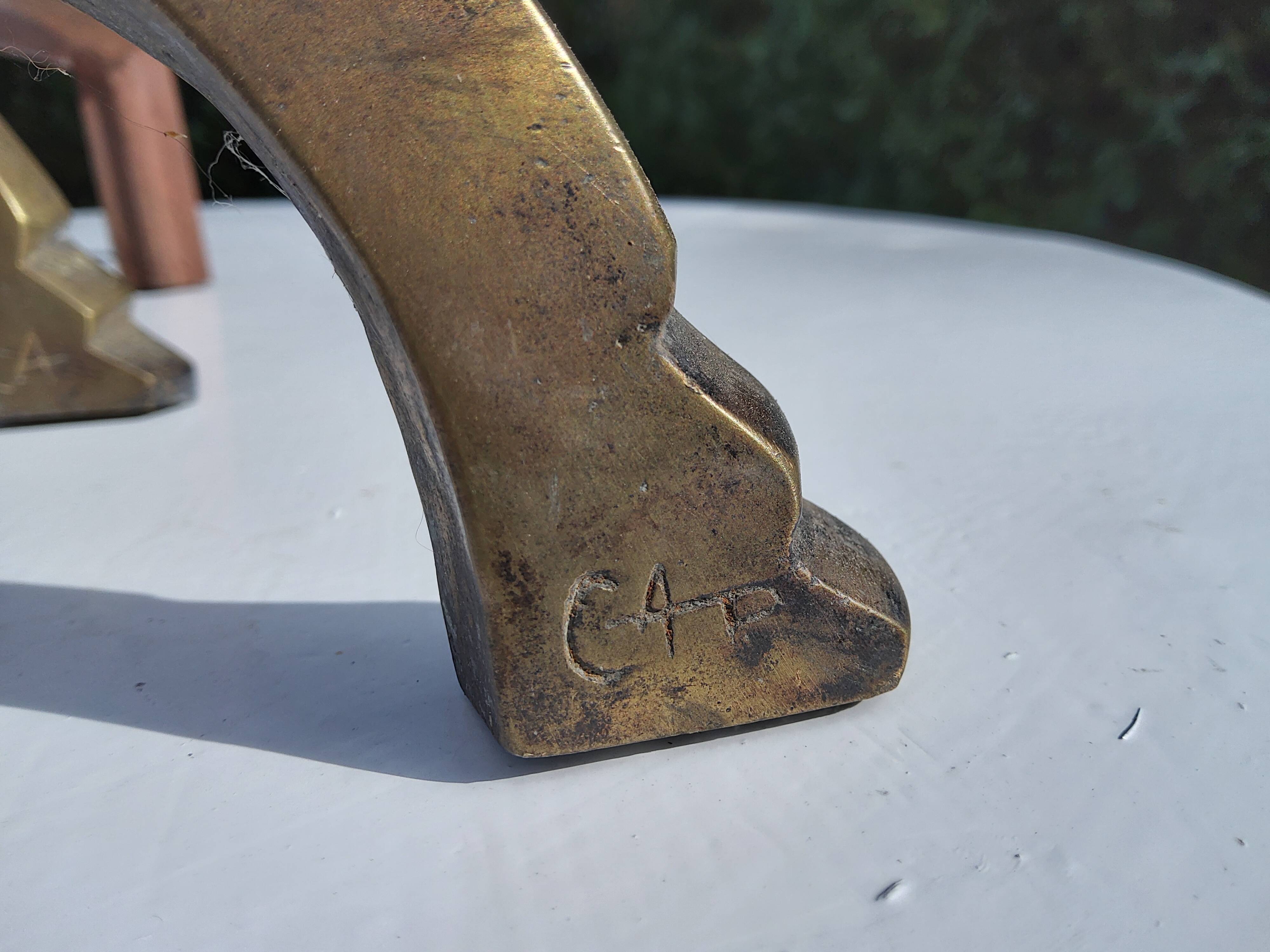 CAP monogrammed andirons