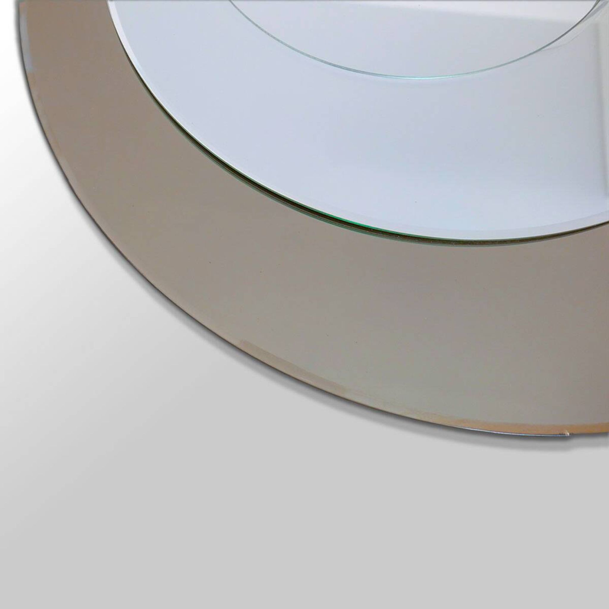 Round brown glass wall mirror attributed to Cristal Art, Italy, 1970s.