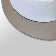 Round brown glass wall mirror attributed to Cristal Art, Italy, 1970s.