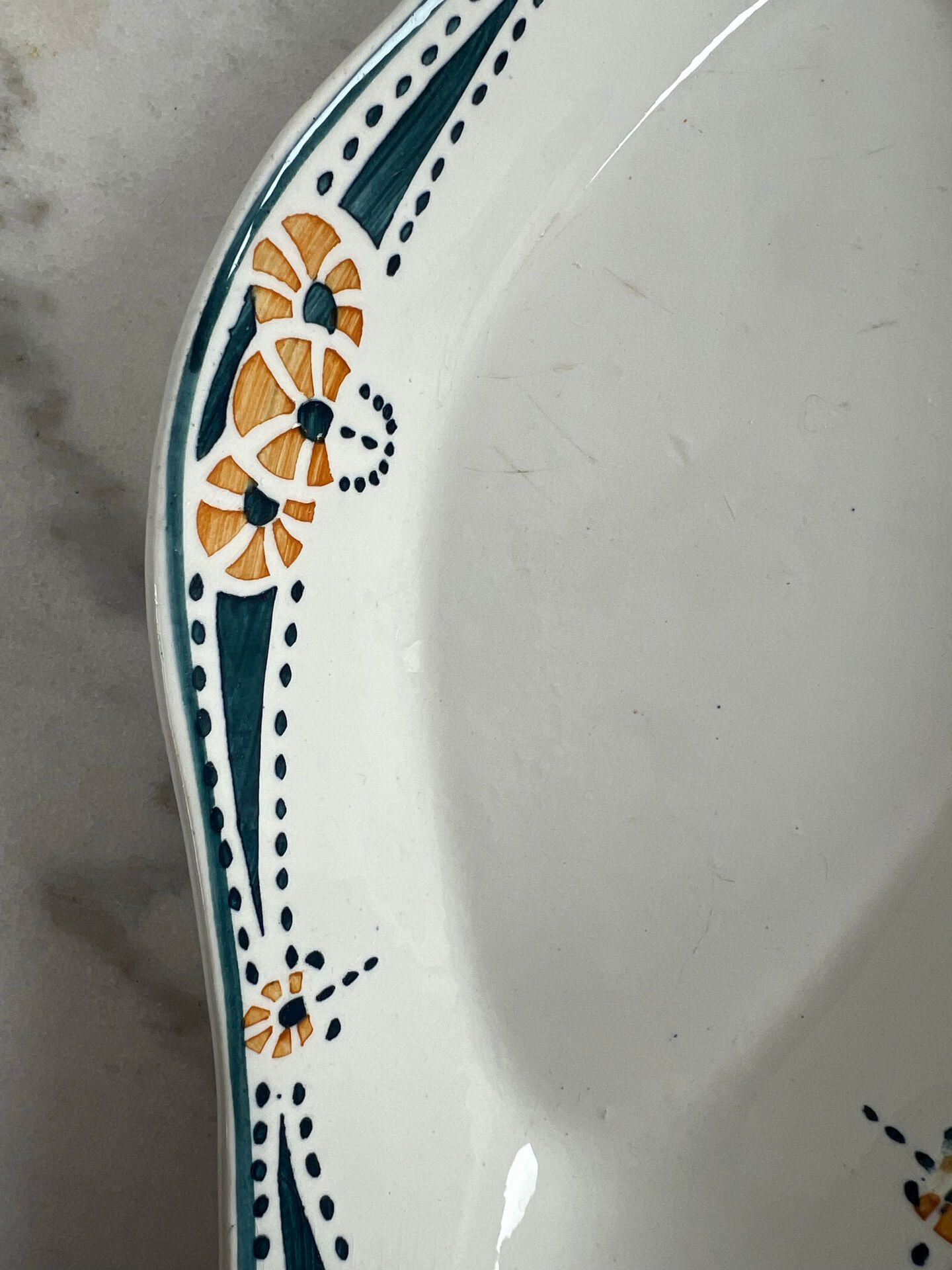 Longwy ramekin with blue and orange floral decoration.