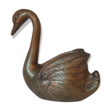 Empty brass swan pocket