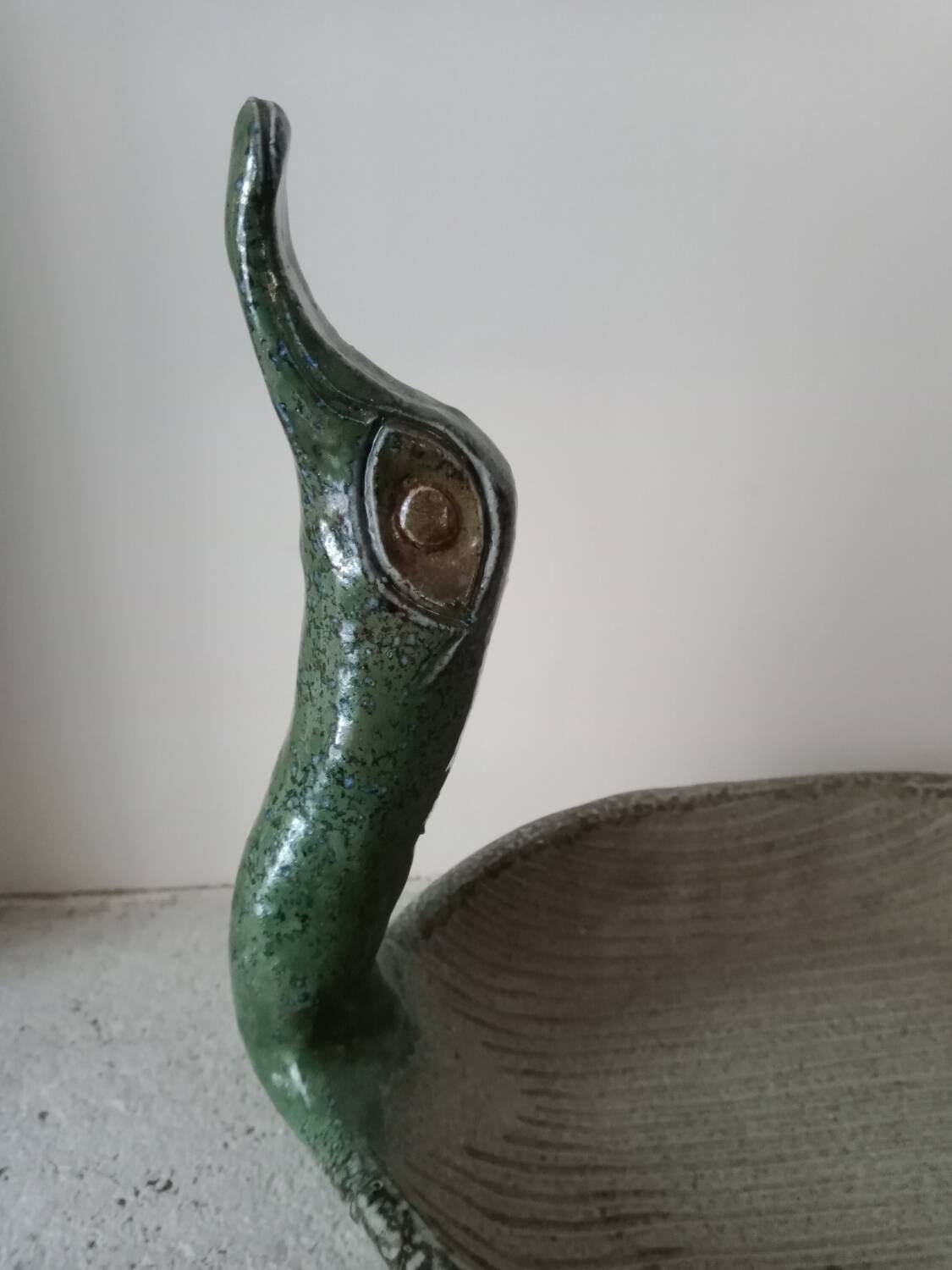 Empty pocket cup forming a bird