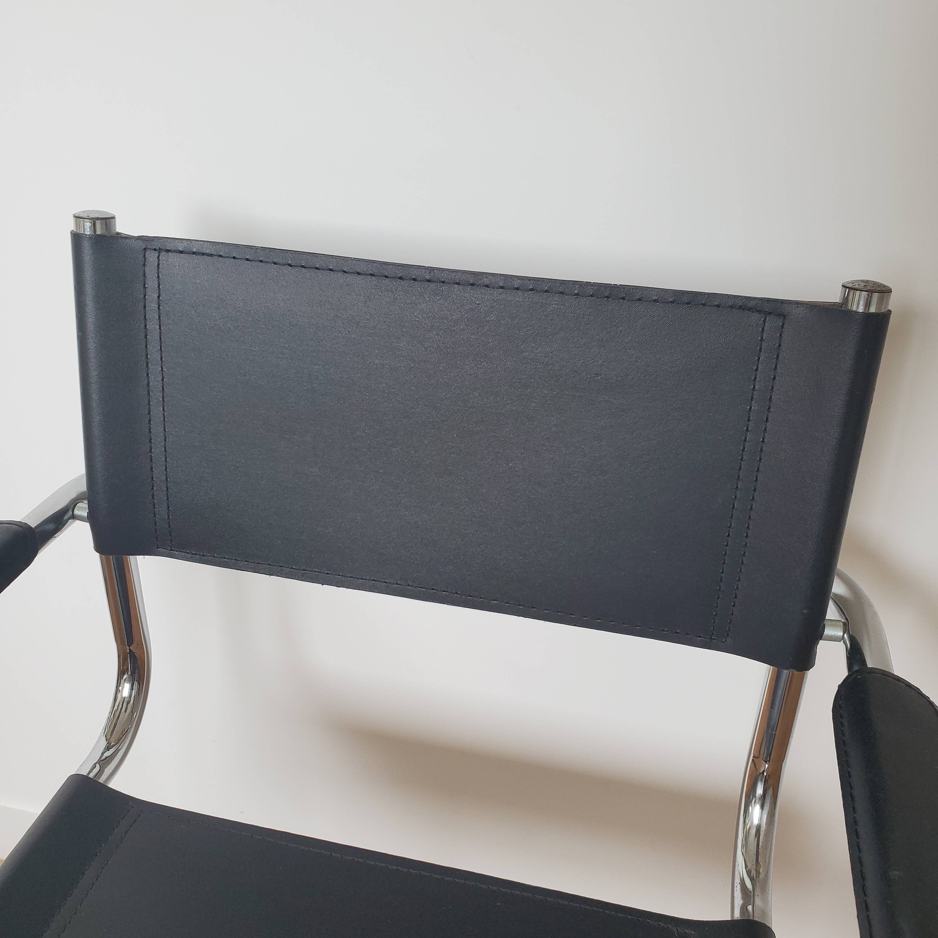 Pair of armchairs in chrome and black leather
