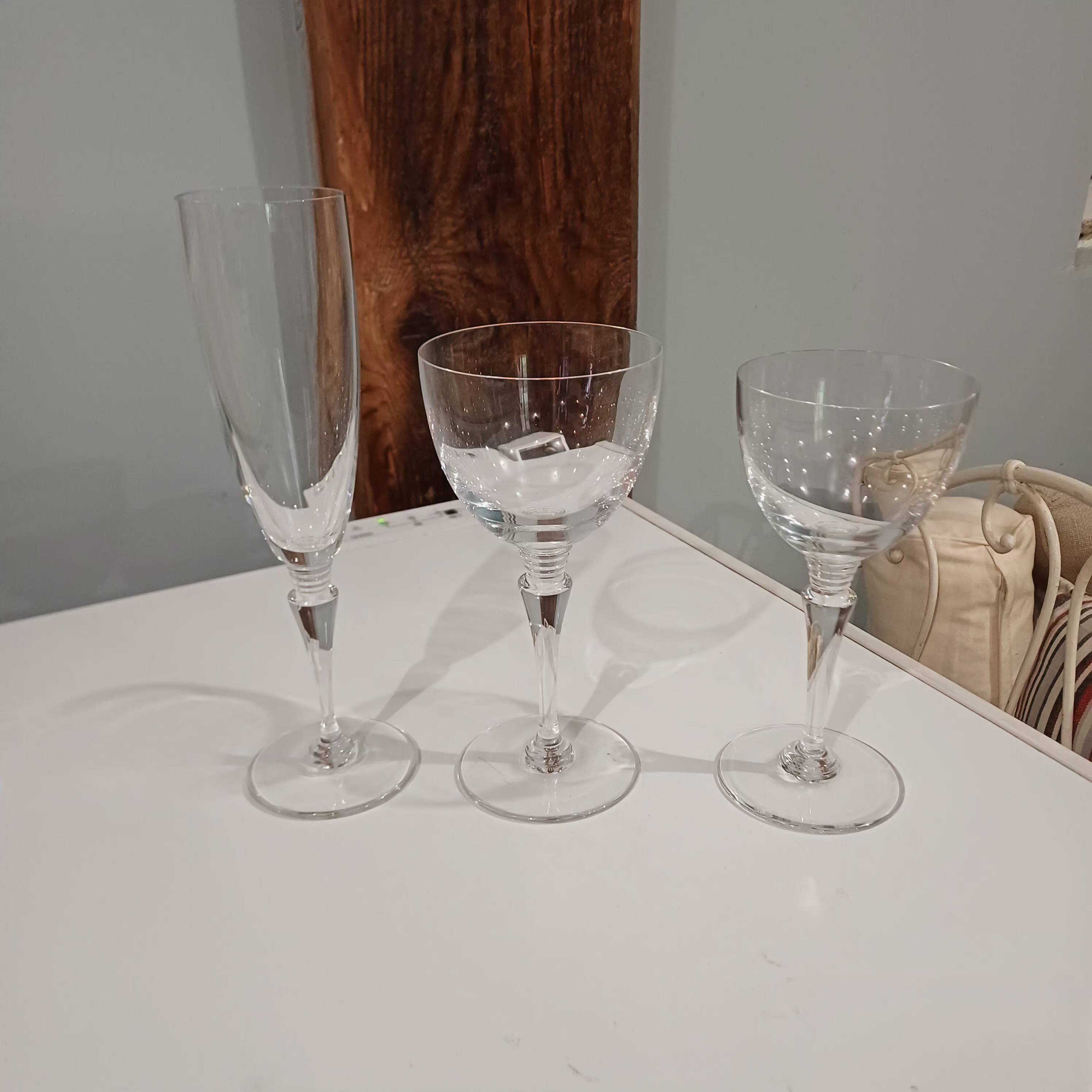 Set of St Louis glasses including 10 flutes, 12 wine glasses, and 12 water glasses.