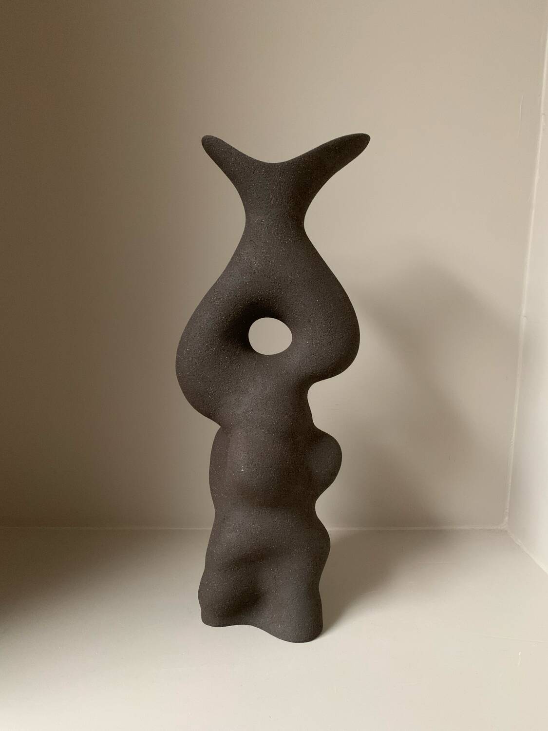 Black stoneware vase in an organic shape