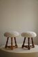 Modern Danish, a pair of tripod stools, seats reupholstered in lambswool, 1950s.