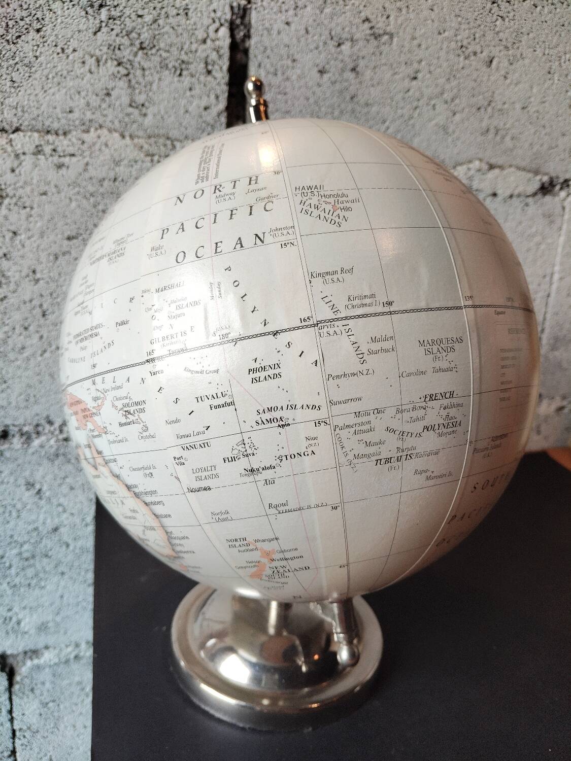 Decorative terrestrial globe on silver metal stand – explorer style