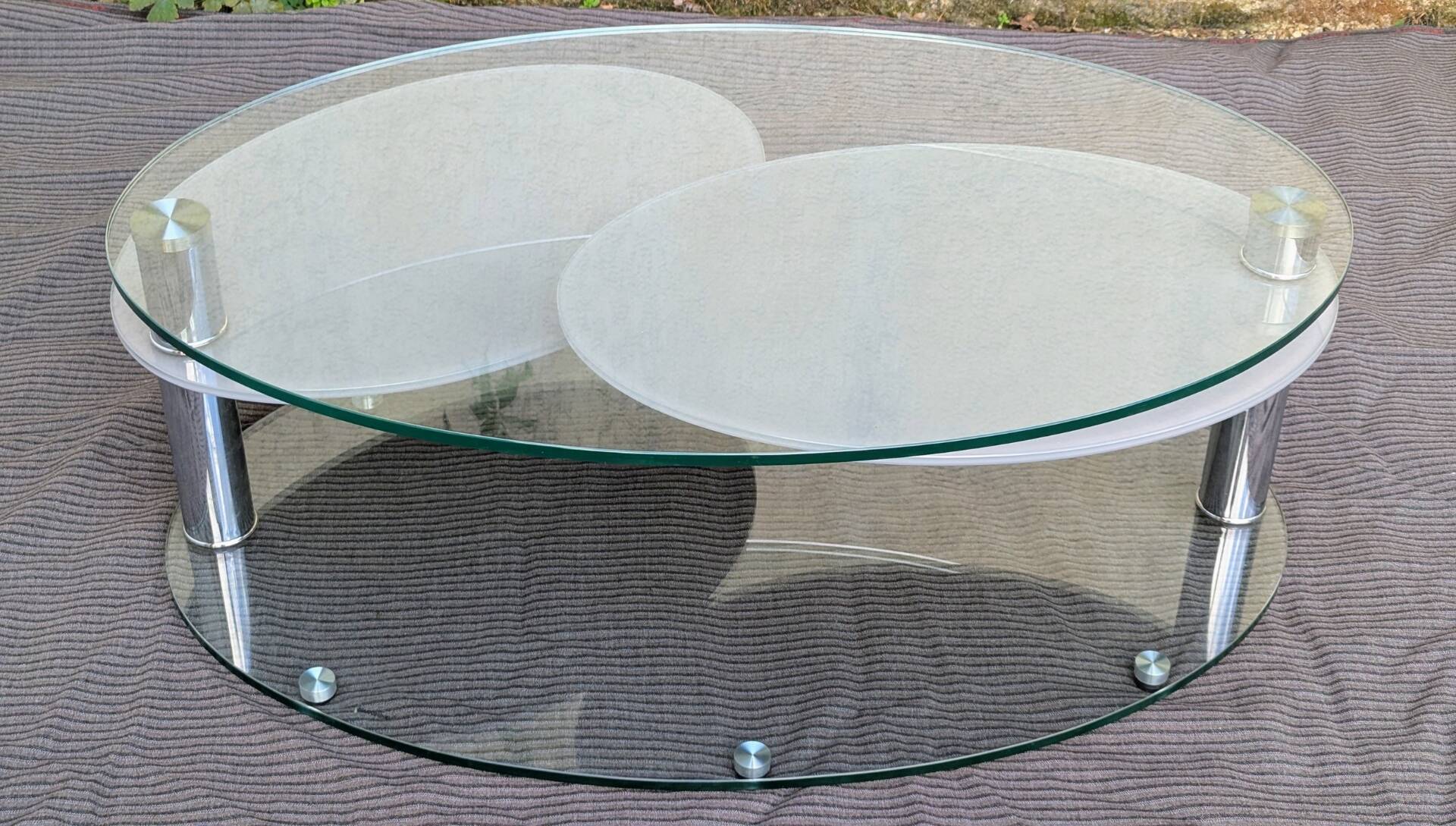 Coffee table with rotating glass tops by Antoine Motard.