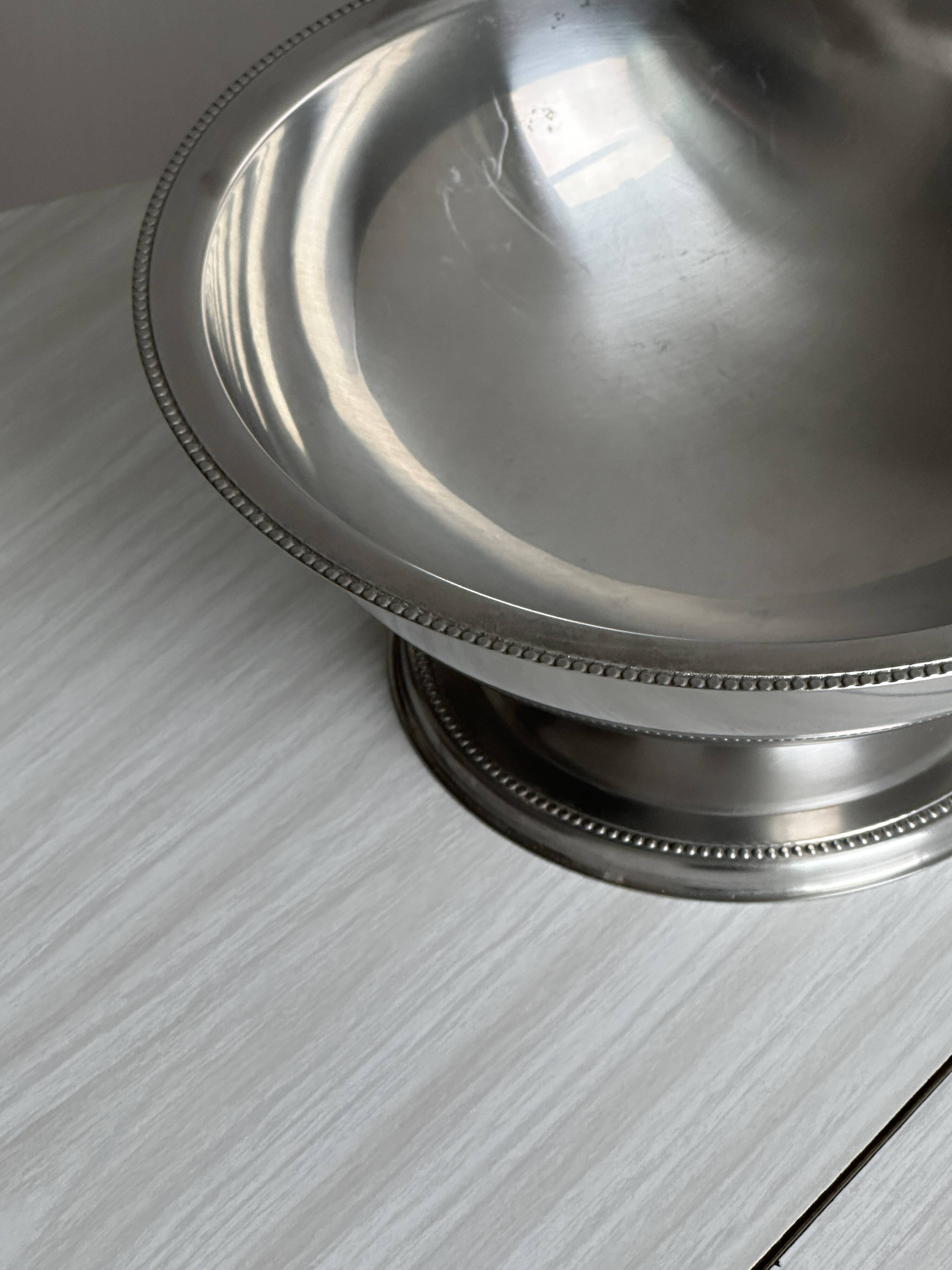 Shiny silver metal salad bowl
