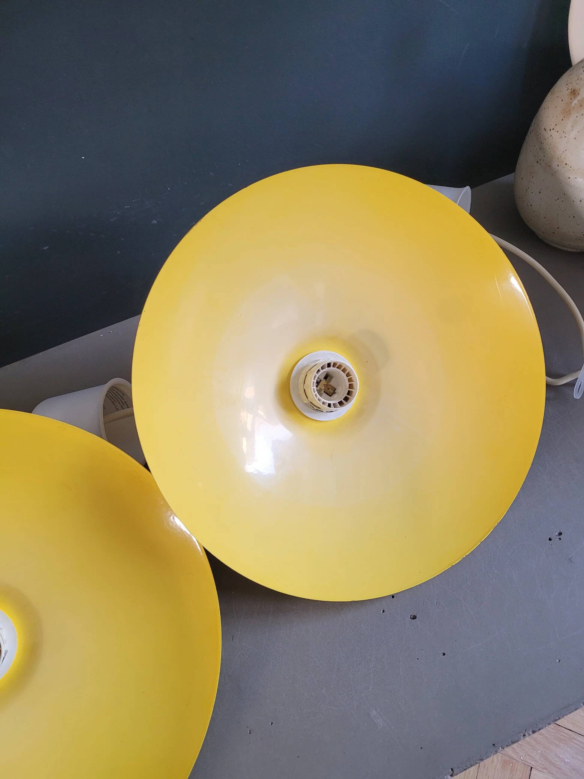 Pair of yellow lacquered metal pendant lights