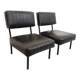 Set of 2 vintage modernist armchairs in black faux leather and metal.