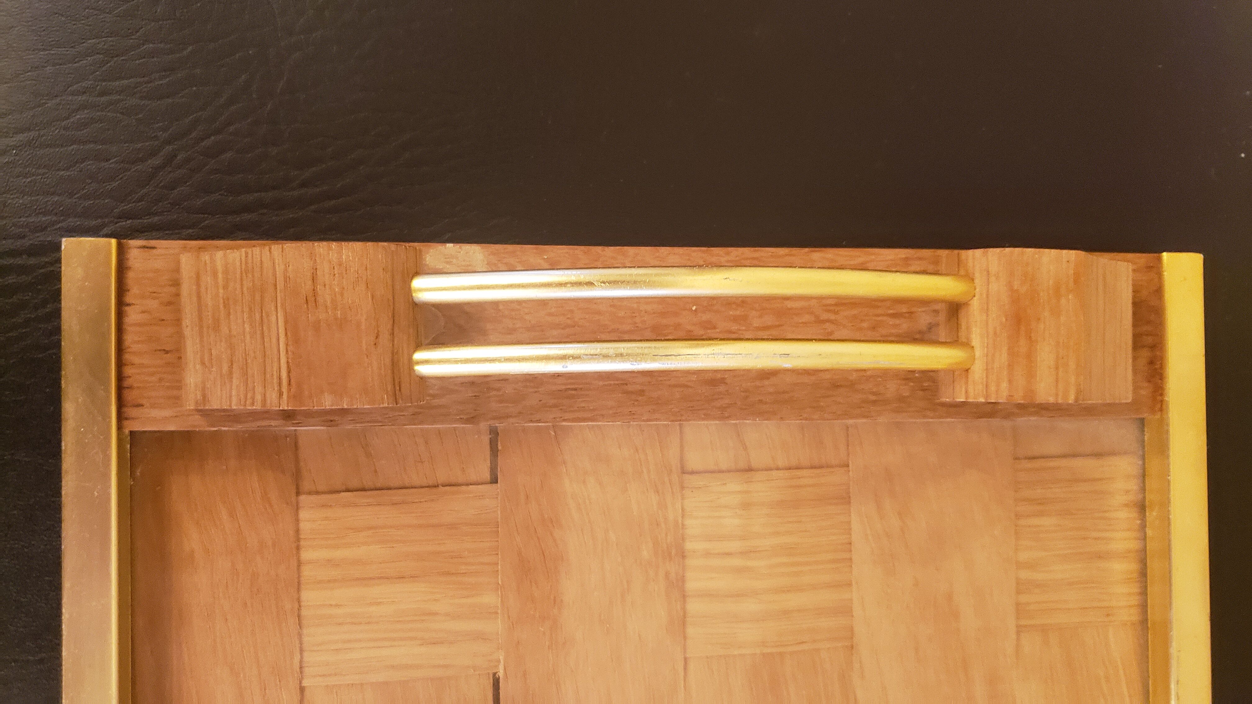 Braided wooden top gilded handles
