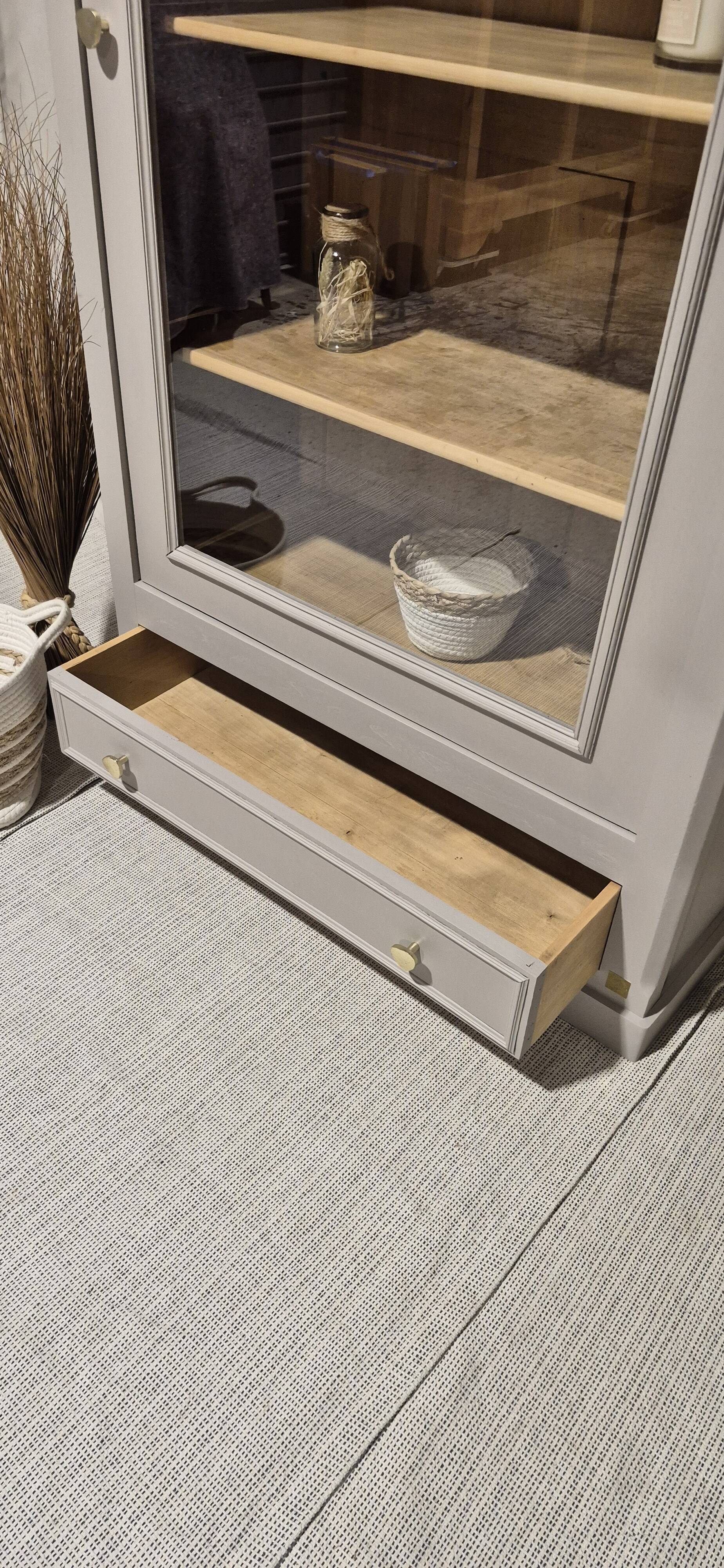 Glass display cabinet with drawer