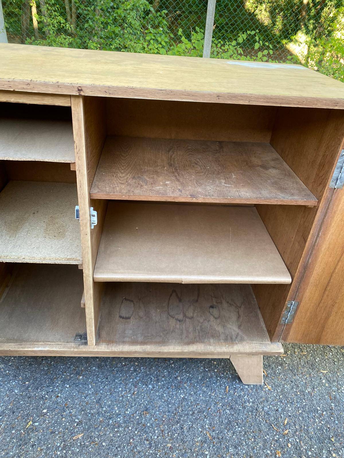 Vintage 1950s oak enfilade buffet with tapered legs.